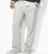 A classic-fitting drawstring pant in soft fleece is designed for casual comfort and style.