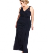 Xscape's plus size gown features beaded shoulders and gathered detail for a sweeping, flattering fit.