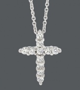 Inspirational style for timeless shine. Express your faith in B. Brilliant's sparkling cross pendant. Crafted in sterling silver with round-cut cubic zirconias (1/3 ct. t.w.). Approximate length: 18 inches. Approximate drop: 5/8 inch.