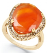 A splash of citrus spices up any look. Crafted in 14k gold over sterling silver, this asymmetrical carnelian stone (6-1/2 ct. t.w.) pops against a sparkling diamond frame (1/5 ct. t.w.). Size 7.