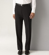 BOSS Black James Brown Trousers. Flat front pants in stretch fabric. 11 front rise, 18 leg opening. Double hook front tab closure. Side seam pockets, back buttoned welt pockets. In virgin wool elastane, cotton-lined to knee.