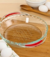 Serve up slices of scrumptious pie with the help of a silicone strip. This handsome pie plate is beautifully designed to present your pie on the kitchen table, while a pair of silicone strips on the bottom of each handle adds an element of grip-ability and slip-free safety. Two-year warranty.