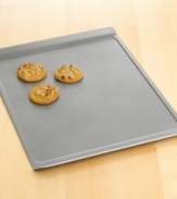 Bake a sizable batch of gooey chocolate chip or moist oatmeal raisin cookies with this large cookie sheet. Features include nonstick interiors and exteriors for easy cleaning, no-hassle food release and optimum baking performance. Large cookie sheet pictured on bottom. Lifetime warranty.