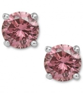 Perfection in pink. These sparkling stud earrings feature round-cut pink diamonds (1/2 ct. t.w.) in a four-prong setting of 14k white gold. Approximate diameter: 1/5 inch.