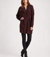 Lengthy silk v-neck with a point collar, slightly shirred back and self-tie at the waist. Point collarV-neckPull-on styleLong dolman sleevesButtoned cuffsSelf tie at waistLonger length hits below the hipsSilkDry cleanImported