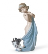 A baby girl and her frisky pup take playtime too far, wrestling over a blankie in Lladro's handcrafted Naughty Puppy figurine.