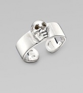 A thick adjustable band with a single prominent skull at the center. Sterling silver Width, about ¾ Made in Italy 