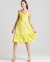 Sunshine-colored ruffles inject a vibrant pop to this ladylike sleeveless Milly dress. Perfect for a daytime party, finish off the look with statement sandals and stacked bangles.