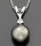 Experience worldly beauty with this intriguing pendant featuring Tahitian cultured pearl (8-9 mm) and round-cut diamond accents set in 14k white gold. Approximate length: 18 inches. Approximate drop: 1/2 inch.