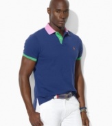 Bold color-blocking enlivens a relaxed-fitting polo crafted from lightweight cotton mesh for the perfect blend of comfort and eye-catching style.