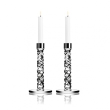 This brilliant pair of candleholders, designed by Lena Bergstrom, was crafted using new techniques that give the look of exquisitely cut diamonds.