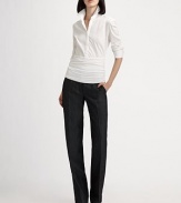 This long sleeve blouse features a crisp tailored top and cummerbund waist giving it a sporty yet chic feel.Shirt collarLong sleeves with button cuffsConcealed button frontFront pleatsRuched bottom panelConcealed side zip74% cotton/21% polyamide/5% elastaneImported of Swiss fabricDry cleanModel shown is 5'9 (175cm) wearing US size 4. 