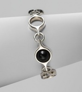 An unique and modern design featuring black agate spherical inset links and sterling silver circular links. Black agateSterling silverToggle closureLength, about 7½Imported 