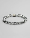 Textured empire link rendered in silver and 18k gold. Box clasp 8½ long Imported