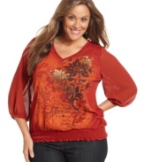 Fall for florals this season with Style&co.'s three-quarter-sleeve plus size top, punctuated by a smocked hem.