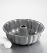 Achieve a perfectly-shaped cake every time with this bundt form pan. Features include nonstick interiors and exteriors for easy cleaning, no-hassle food release and optimum baking performance. Reinforced nonstick surface also offers long-lasting durability. Constructed of aluminized steel to resist rusting. Rolled edges are reinforced with tinned steel wire for added strength. Oven safe to 450 degrees. Lifetime warranty. Model BW6110.