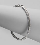 From the Silver Ice Crossover Collection. A twisted cable crisscrosses a diamond band in this graceful bangle of sterling silver and 14k white gold. Diamonds, 0.49 tcw Sterling silver and 14k white gold Diameter, about 2¼ Made in USA