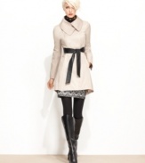 Looking for a sleek way to stay dry? Steve Madden's flared raincoat features a unique asymmetrical collar and a faux-leather belt for extra edge.