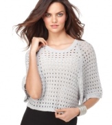 A hot layering piece, this BCBGMAXAZRIA open-stitch sweater adds on-trend texture to any outfit!