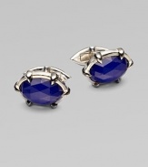 A dashing pair of sterling silver cufflinks with luxe semi-precious inlays.Lapis or quartzPolished and black rhodium-plated sterling silverAbout 1W X ½HImported