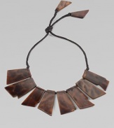 This bold, statement-making design is made up of glossy, geometric tortoise panels.HornCotton cordLength, about 8Pendant length, about 2½Imported