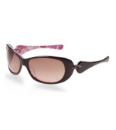 Organically Rounded, voluptuous contours and a smooth, sleek finish heighten the feminine allure of this design. This sporty yet conservative style fuses classic and retro design enhanced by authentic Oakley metal icons on an acetate frame. The inside of the eye wear stems features the breast cancer awareness pink ribbon design to make this style completely unique. It struts on the beach and the streets, begging onlookers to take notice.