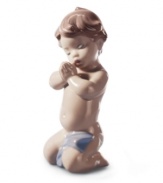 An angelic little baby counts his blessings in this precious Lladro figurine, delicately handcrafted in fine porcelain. Cute for a child's bedroom.