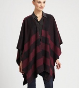 Signature check pattern is printed on sumptuous cashmere in a cape silhouette.Cashmere66 X 47Open frontDry cleanImported