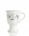 Warm the hearts of your guests with spiced wine or hot cocoa in this beautifully festive Winterberry mug from Pfaltzgraff's holiday collection of dinnerware and dishes. Bright red berries and holly vines accent the sides of this footed mug. (Clearance)