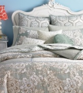 Let your creativity blossom with Style&co.'s Pastiche reversible quilt, boasting a geo print on one side and contrast vine design on the reverse for fresh, mix-and-match looks. (Clearance)