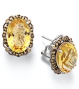 Add a touch of sunshine. These stunning sterling silver earrings highlight an oval-cut citrine (9-1/2 ct. t.w.) and a halo of round-cut yellow Swarovski zirconias (1/2 ct. t.w.). Approximate length: 3/4 inch. Approximate width: 1/2 inch.