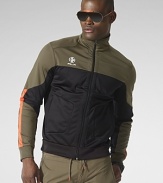 An active fusion of stretch microfiber and mesh, an essential jacket is designed for high performance and a sporty aesthetic with a protective mockneck collar and Coolmax® technology.