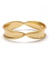 A new twist: It may be a traditional bangle silhouette, but the unique design of this Kenneth Cole New York bracelet gives it a fresh perspective. Crafted in gold tone mixed metal. Approximate length: 8 inches.