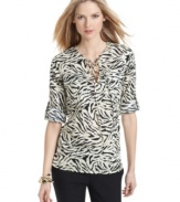 Add safari style to your spring wardrobe with this MICHAEL Michael Kors animal-printed blouse!