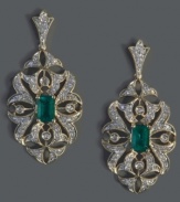 Another truly dazzling design from Effy Collection, these gorgeous drop earrings highlight emerald-cut emeralds (1 ct. t.w.) surrounded by intricate cut-outs accented with round-cut diamonds (1/2 ct. t.w.). Set in 14k gold with a post backing. Approximate drop length: 1-2/5 inches. Approximate drop width: 2/3 inch.