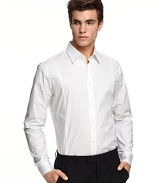 Slim fit, long sleeve shirt with spread collar. Button front with barrel cuffs. Clean front, no pockets. Rounded hem.