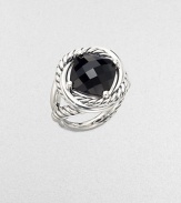 From the Infinity Collection. A deep, dramatic faceted stone of black onyx in a setting formed of intertwining smooth bands and cables of sterling silver.Black onyxSterling silverDiameter, about ½Imported