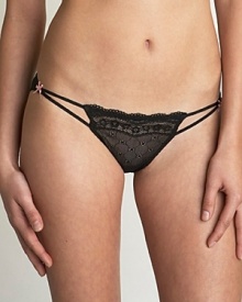 A sheer lo-rise bikini with lace front and ruching in back. Cotton gusset.