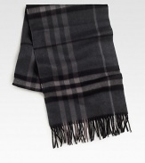 Luxurious and soft cashmere in a classic oversized check pattern with fringed edges.Fringed edgesAbout 12W x 66LCashmereDry cleanImported