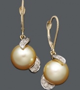 Lavish yourself in the luxurious. These rich drop earrings features a golden South Sea pearls (9-10 mm) accented by glittering round-cut diamonds (1/5 ct. t.w.) in a warm 14k gold setting. Approximate drop: 1-1/4 inches.