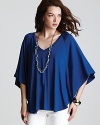 With an easy silhouette and brilliant cobalt finish, this Vivienne Vivienne Tam tunic evokes a cool dip.