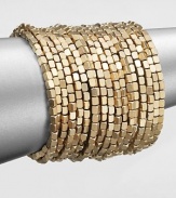 Satin finished, goldtone beading makes a dramatic statement in this coil wrap design.Brass Diameter, about 2½ Imported 