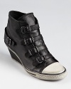 A modern fusion from Ash, featuring dramatic buckles down the vamp and a distressed rubber sole.