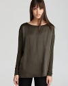 The rich silk body of this Vince top is contrasted by cozy knit sleeves for cool juxtaposition.