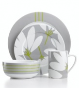 Stylized blooms and ticking stripes mix things up in the graphic Fan Floral place settings. A subdued gray, white and green palette softens the bold patterns in everyday porcelain from Echo Design.