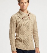 A striking, sophisticated cable-knit sweater is shaped in a luxurious lambswool blend, accented with faux-leather button detail at the collar.TurtleneckRibbed knit collar, cuffs and hem80% lambswool/20% polyamideDry cleanImported