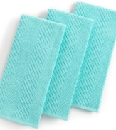 Grab style and keep function with a set of three kitchen towels that step forward in an eye-catching color to wipe up spills, aid in prep and add an accent to your space. The textured design sets a sharp appearance for any room, while the highly absorbent terry quickly cleans up. Limited lifetime warranty.