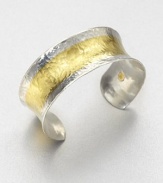 A concave design in sleek sterling silver and radiant 24k gold with a stunning hammered texture. Sterling silver24k goldSlip-on styleImported 