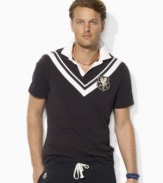 Designed in washed cotton jersey for a timeworn look and feel, a trim-fitting rugby shirt captures the timeless sensibility of vintage sportswear with preppy chevron stripes and bold embroidery.