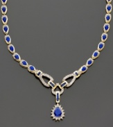 A stunning and sophisticated style, sure to turn heads. Pear-shaped sapphires (12 ct. t.w.) and round-cut diamonds (1/5 ct. t.w.) set in 14k gold. Length measures 16 inches; drop measures 1 inch.